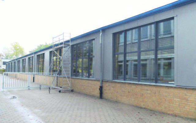 Reinbek: Produktionshalle - energetische Sanierung der Fassade, Thermopaneele und Kunststofffenster | Foto: Bebatherm