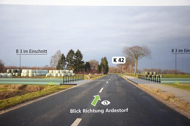 Die Visualisierung zeigt, wie die unter der Kreisstraße 42 tief im Gelände liegende Ortsumgehung (links und rechts der Geländer) nahezu unsichtbar würde